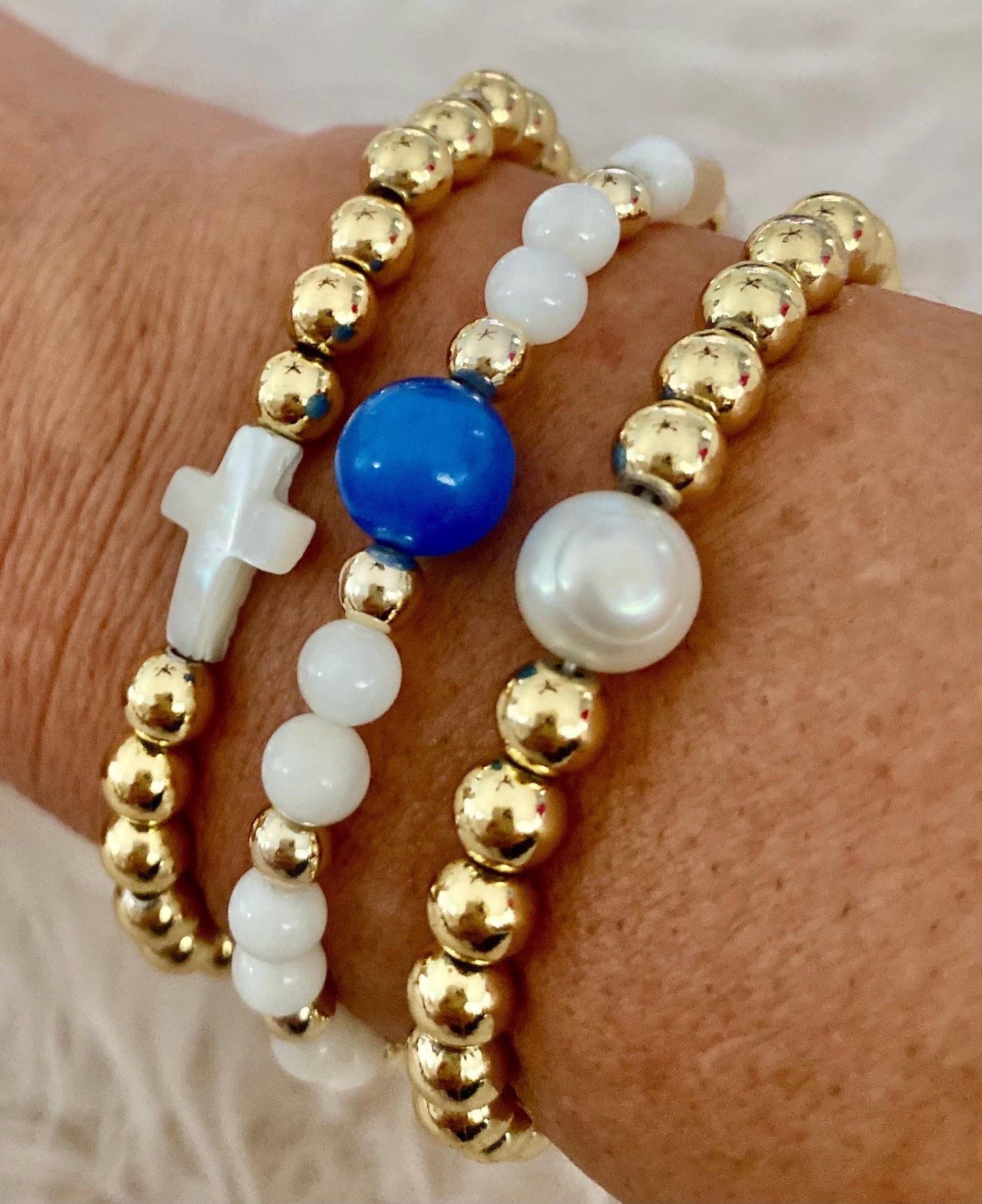 14k Gold Filled Beaded Bracelet: Center Mother of Pearl Cross, Rice Pearl, Clover Charm.