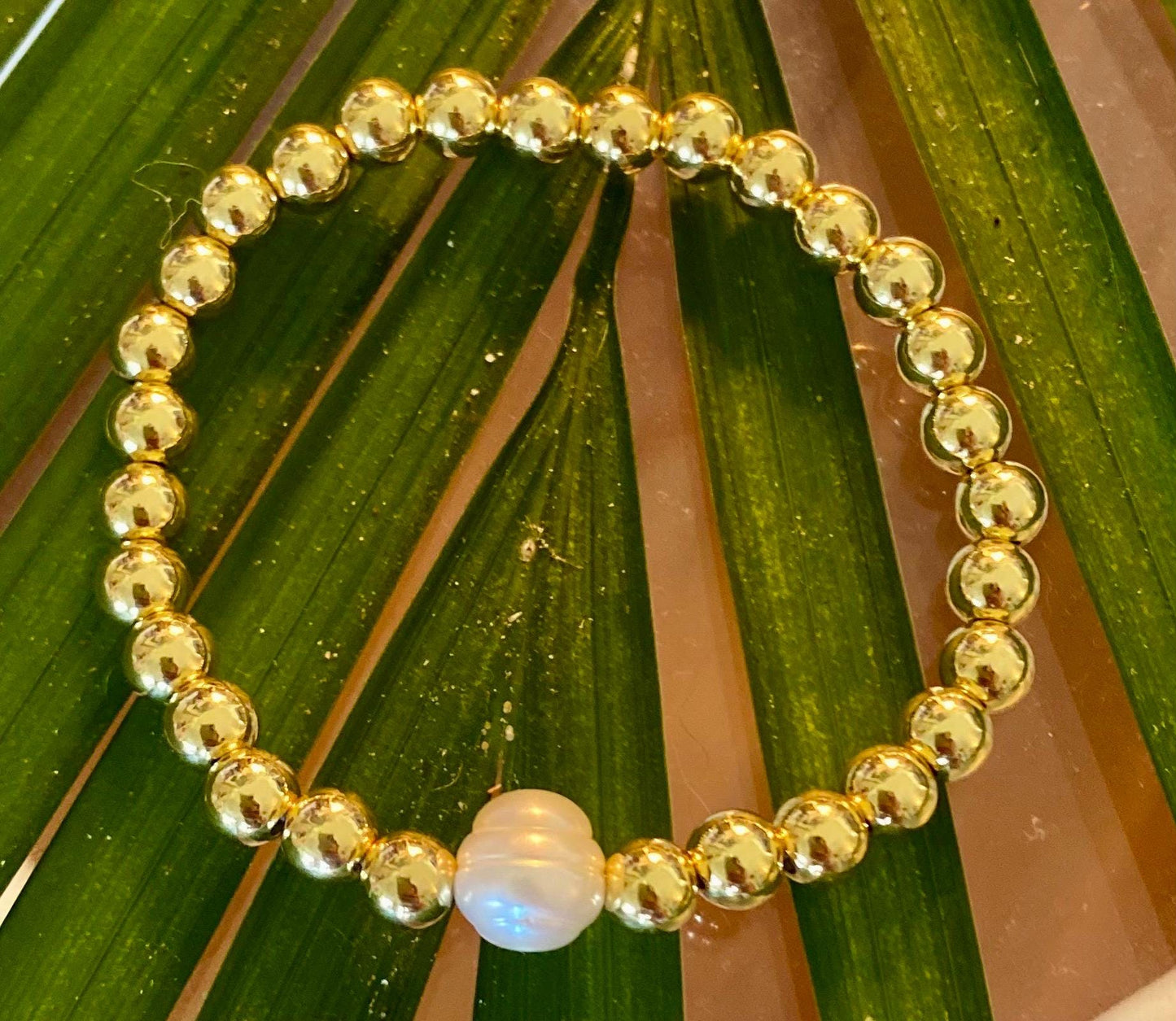 14k Gold Filled Beaded Bracelet: Center Mother of Pearl Cross, Rice Pearl, Clover Charm.