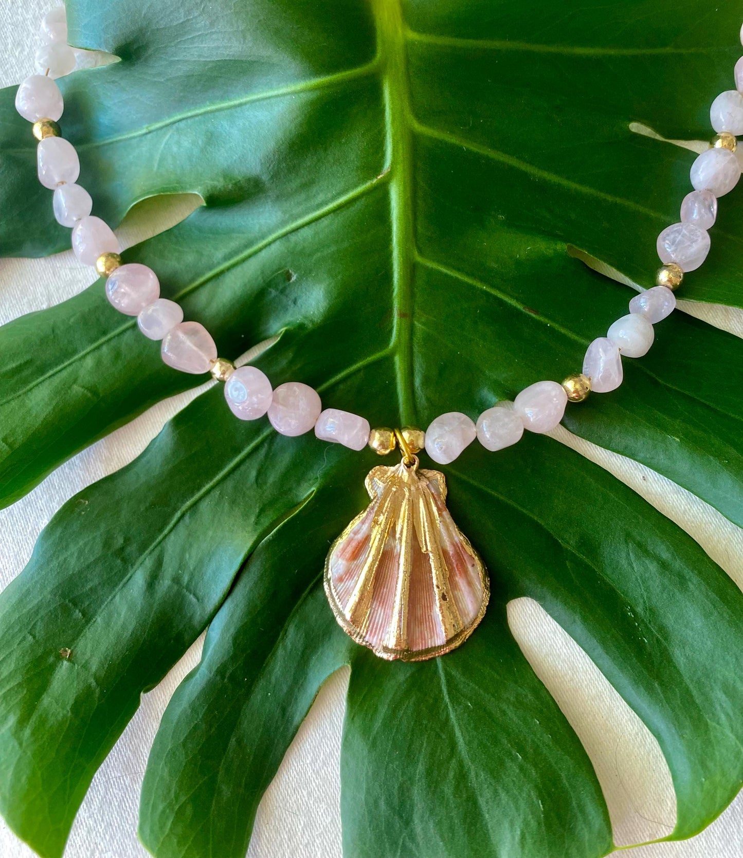 Rose Quartz Beaded Necklace: Center Gold Scallop Shell Charm. 14K Gold accents.