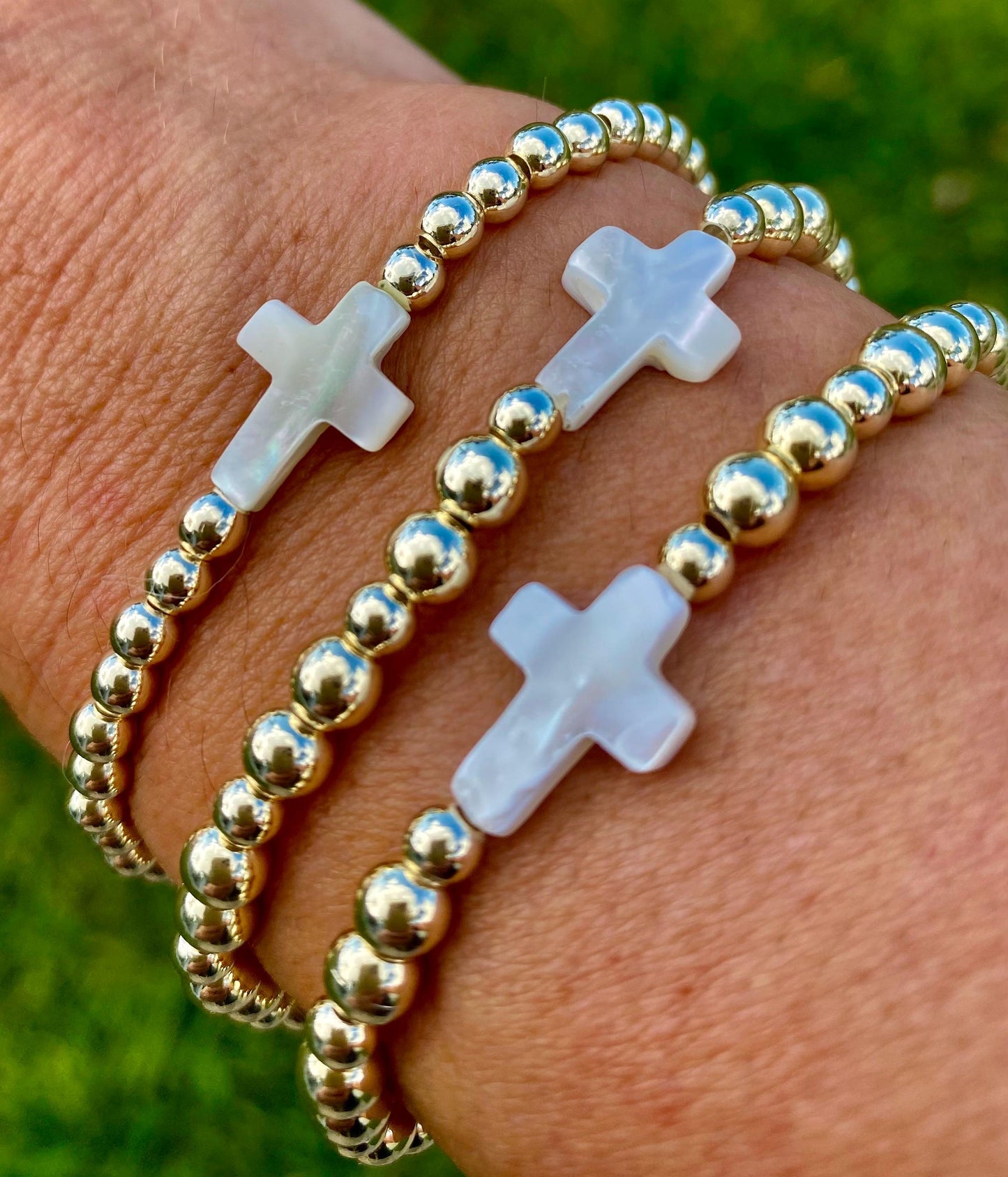 14K Gold Filled & Silver Plated Stacking Bracelets. Center Mother of Pearl Cross.