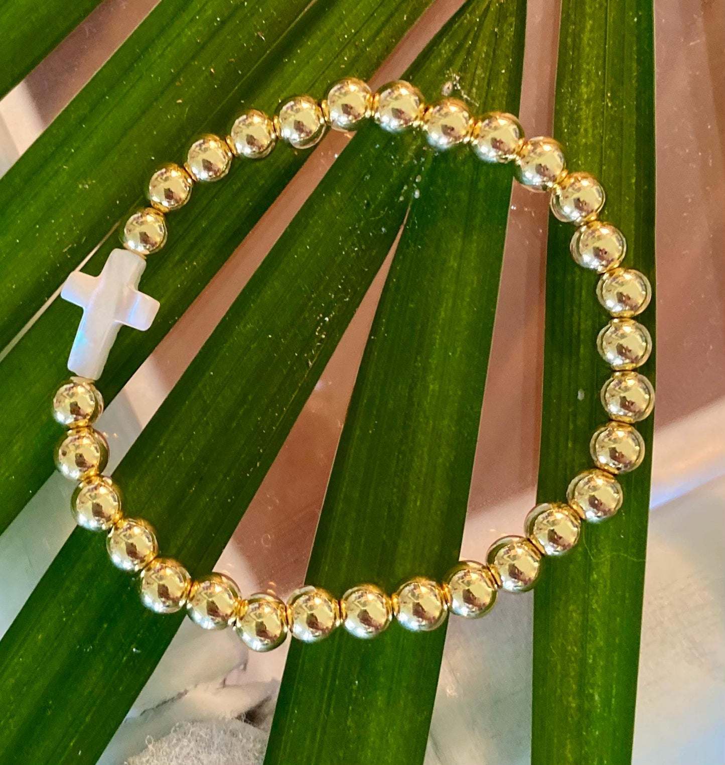 14k Gold Filled Beaded Bracelet: Center Mother of Pearl Cross, Rice Pearl, Clover Charm.