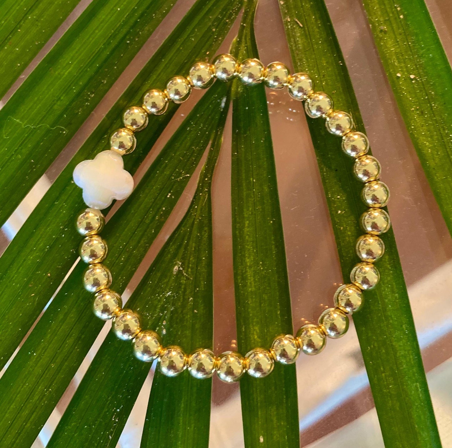 14k Gold Filled Beaded Bracelet: Center Mother of Pearl Cross, Rice Pearl, Clover Charm.