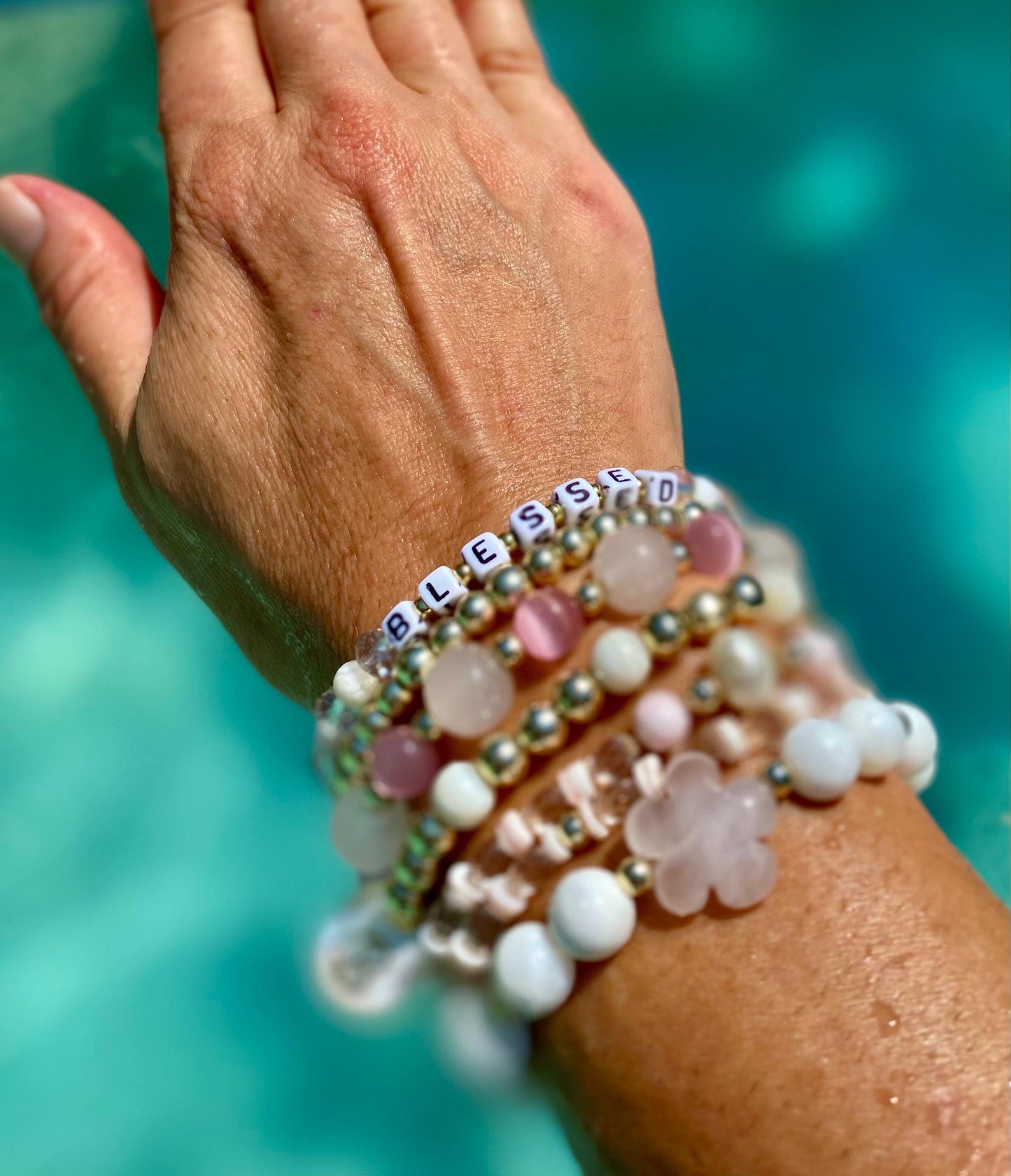 Rose Quartz Flower Charm Bracelet: 14k Gold & White Shell Beads.