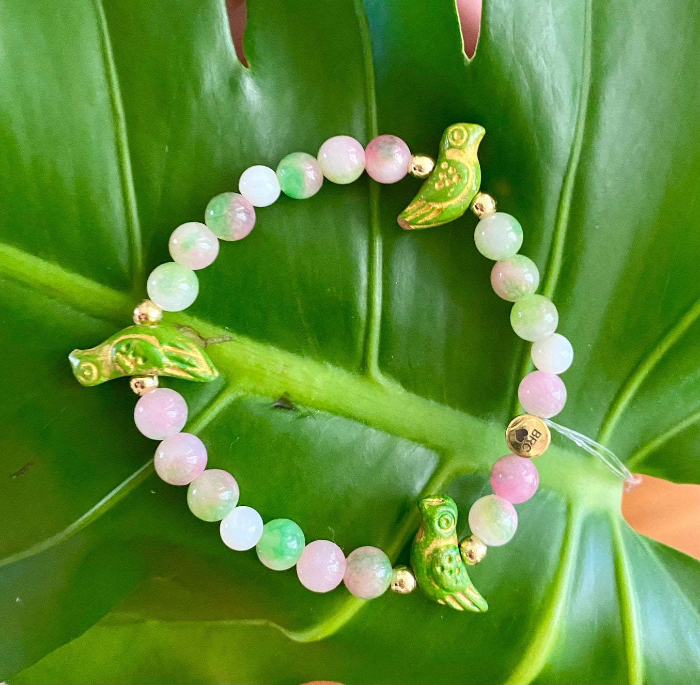 Pink Parakeet Friendship Bracelet: Pink & Green Glass Beads, Ceramic Green & Gold Birds.