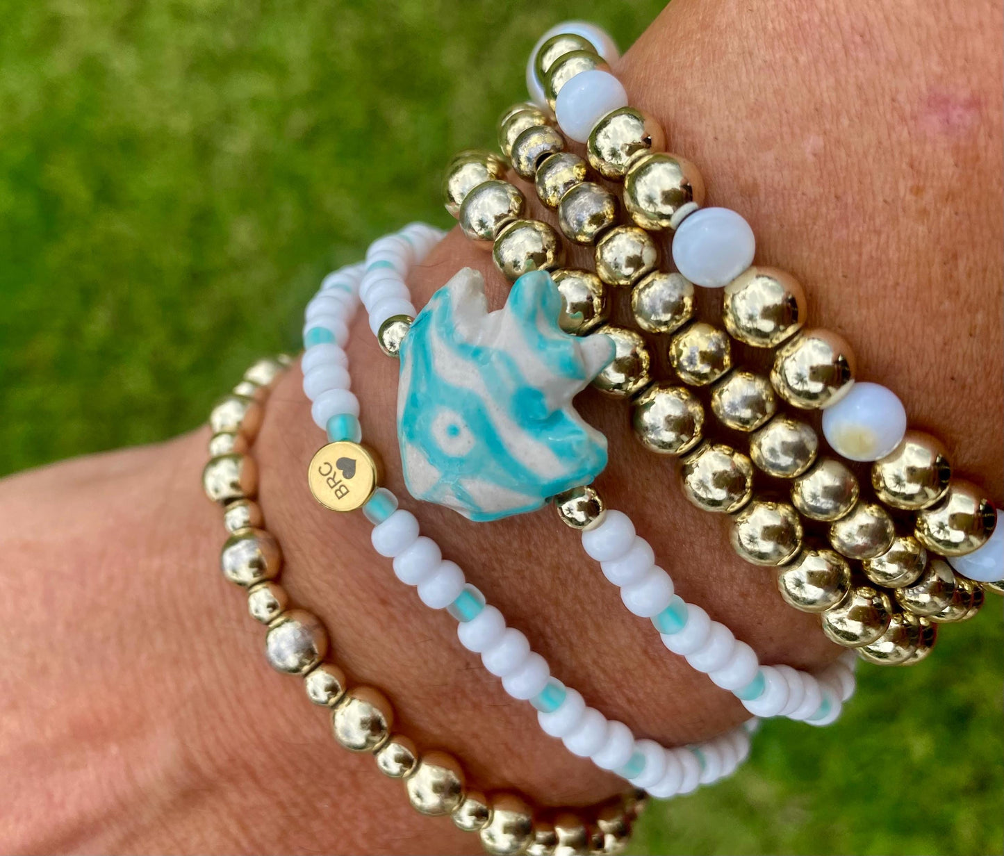 Ceramic Fish Beaded Stretch Bracelet: Turquoise & White Seed Beads.